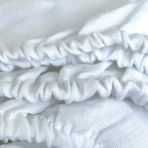 Białe lniane prześcieradło z gumką snow white
białe uniwersalne prześcieradło z lnu, detal, gumka