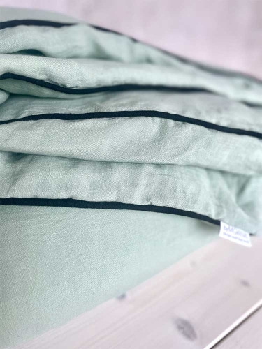 lniana poszewka na kołdrę  jasno zielona z czarną wypustką